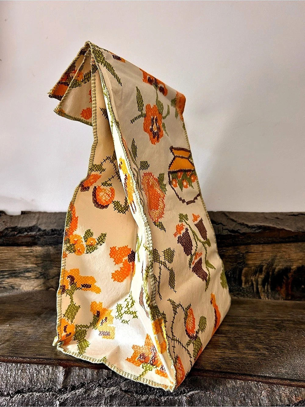 Vintage reusable vinyl lunch bag designed to mimic the classic brown paper bag